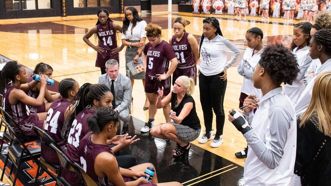 Timberview coach Kit Kyle Martin talks to her team during a timeout on Monday, Feb. 18, 2019 against Boswell. The Wolves won 68-46.
