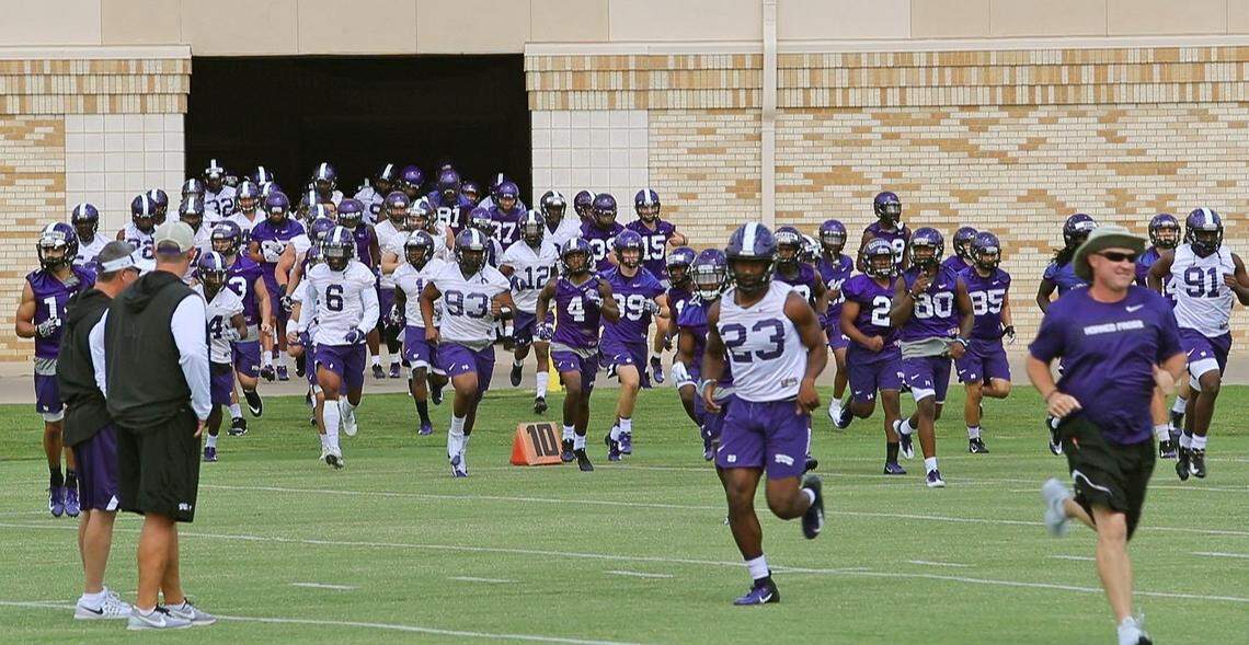 The TCU Horned Frogs leave warmups for the field as the team holds their first regular preseason practice in Fort Worth, Saturday, August 4, 2018.