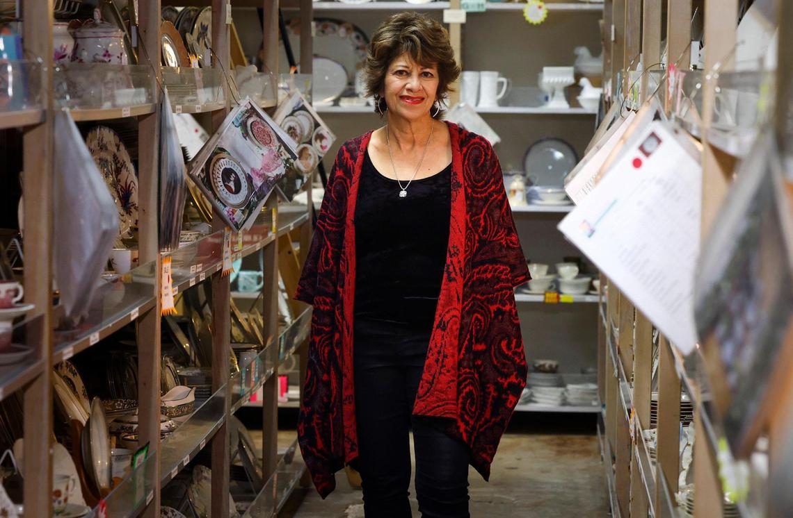 Laura Keith, owner of Dishes Encore, poses for a photo in her shop on Friday, December 15, 2023. Dishes Encore won second place in this year’s Star-Telegram Readers Choice poll for best places to shop local for Christmas gifts.