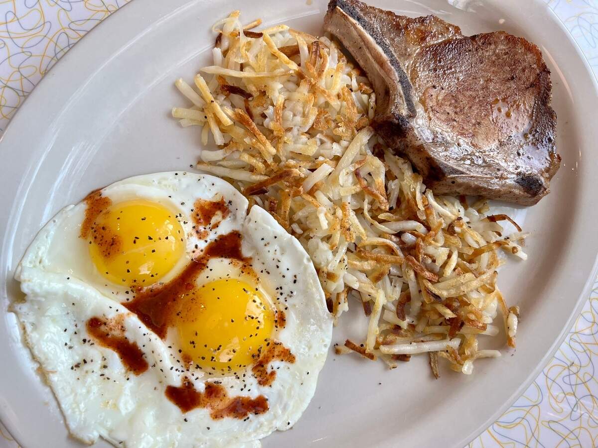 A pork chop breakfast at the Paris Coffee Shop.