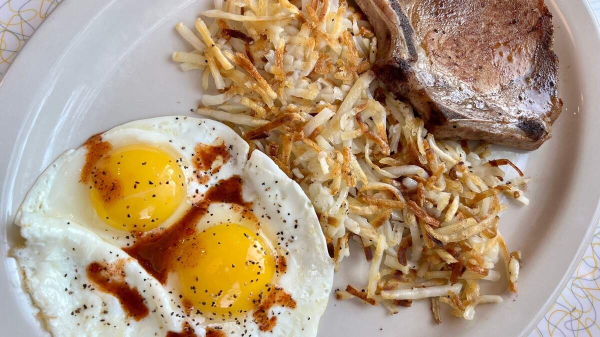 A pork chop breakfast at the Paris Coffee Shop.