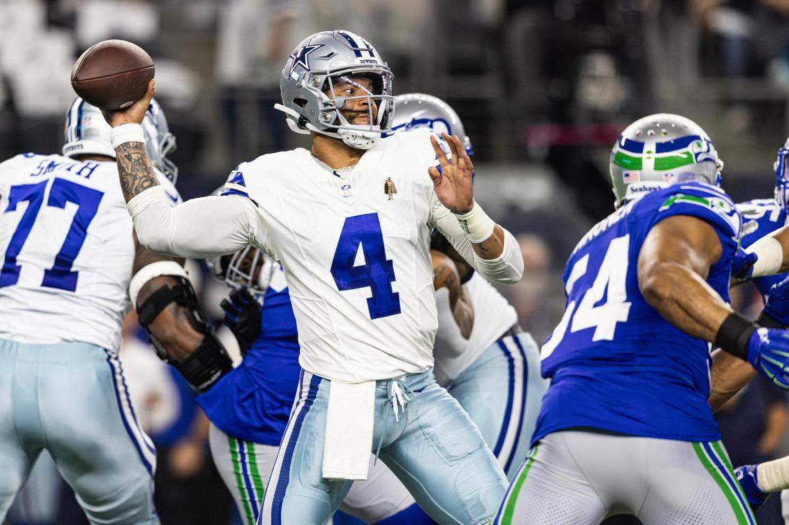 Dallas Cowboys quarterback Dan Prescott (4) throws against the Seattle Seahawks at AT&T Stadium in Arlington on Thursday.