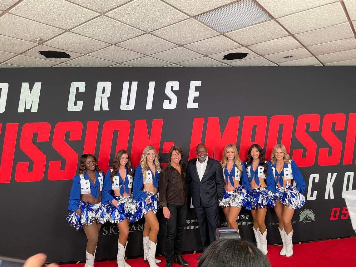Tom Cruise, Emmitt Smith and Dallas Cowboys cheerleaders at the Dallas red carpet for “Mission: Impossible - The Final Reckoning” on Thursday, May 22, 2025.
