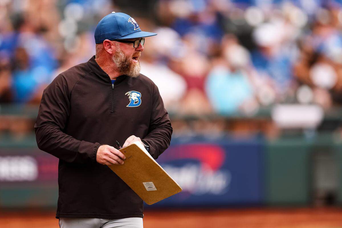 Brock head coach Koby Page yells toward his team while holding a clipboard in the UIL Class 4A Division II baseball state championship game against Robinson on Friday, June 5, 2026, at Dell Diamond in Round Rock, Texas.