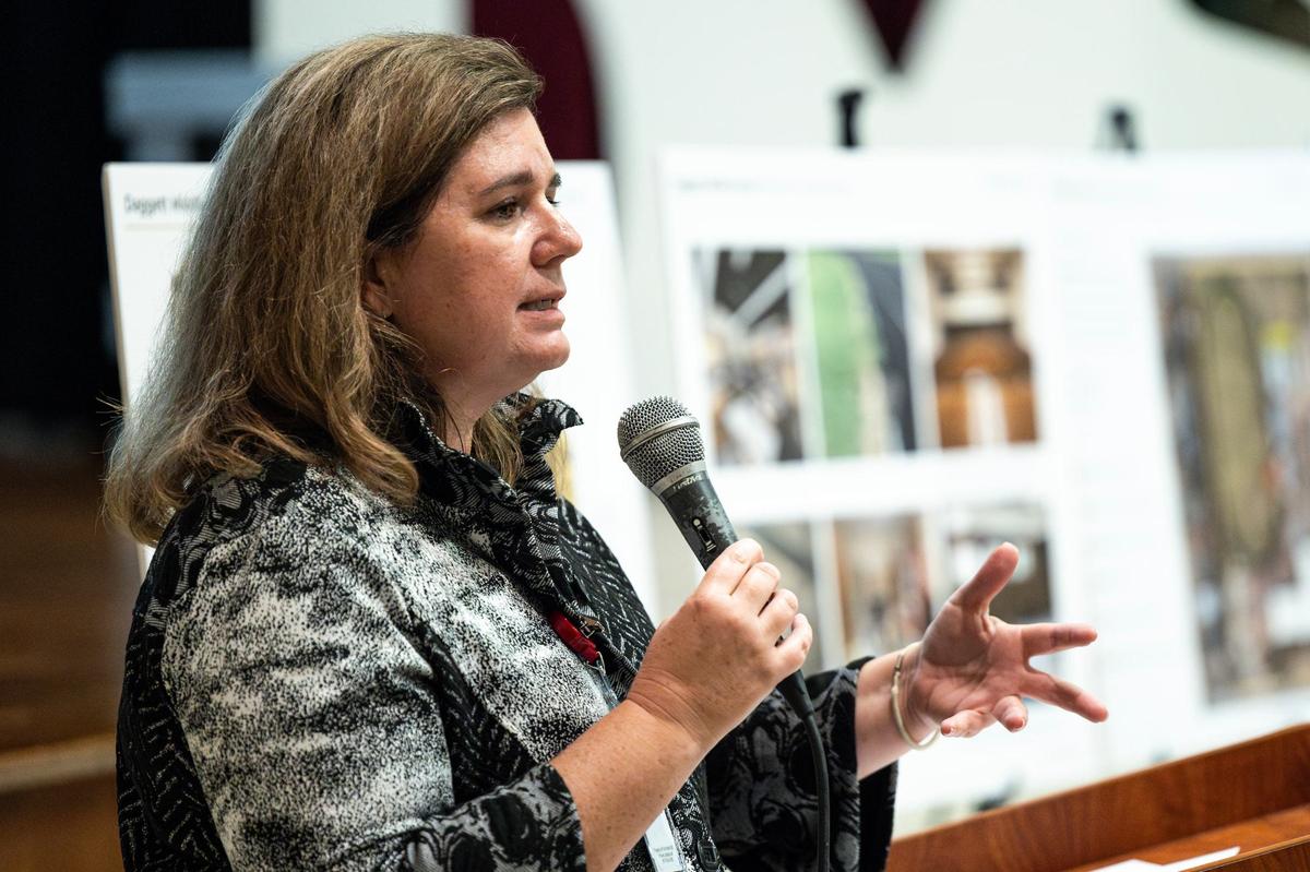 Kellie Spencer, the deputy superintendent for operations in the Fort Worth Independent School District, speaks to the crowd gathered for a FWISD community listening session at Daggett Middle School in Fort Worth on Thursday.