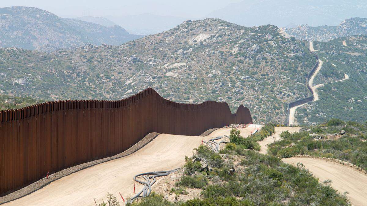 A former border official was sentenced to federal prison for helping a Mexican cartel smuggle unauthorized people and drugs into the United States, federal officials said.