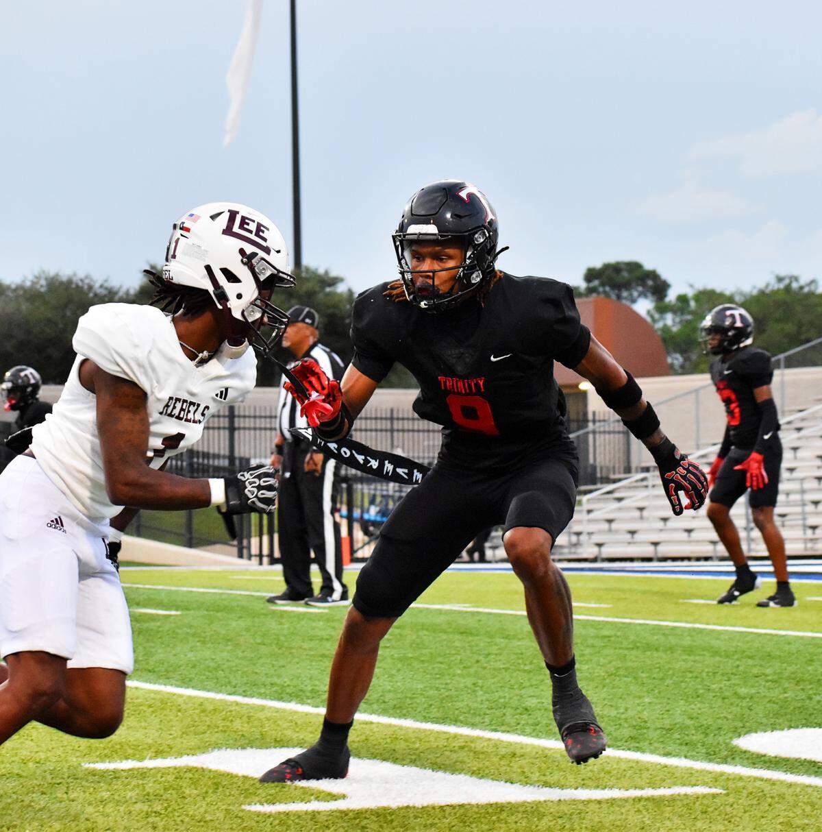 Midland Legacy wide receiver Mackenzie Rogers, left, runs a route while being guarded by Euless Trinity cornerback John Meredith III in the first quarter of a UIL football Class 6A game at Pennington Field on Friday, Sept. 5, 2025.