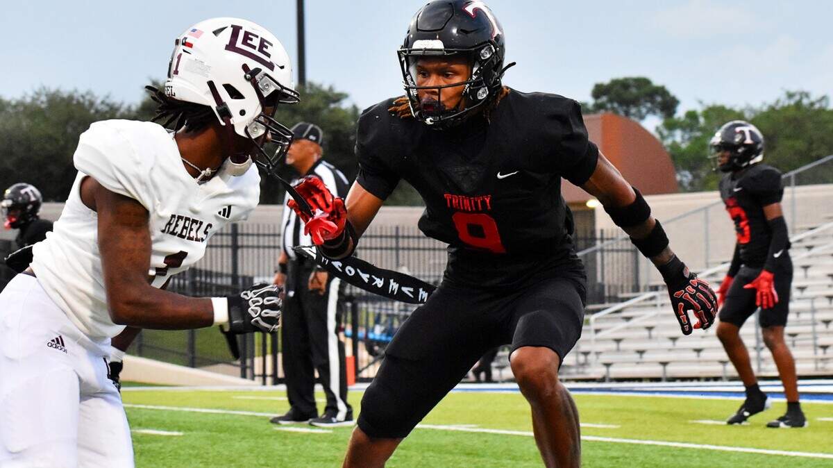 Euless Trinity cornerback John Meredith III (right) guards Midland Legacy wide receiver McKenzie Rogers during the first quarter Sept. 5, 2025, at Pennington Field in Bedford.