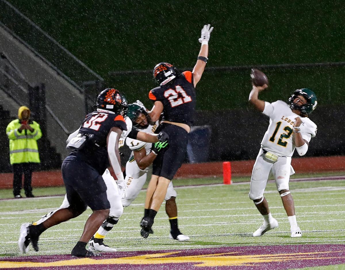 Longview quarterback Jordan Allen (12) makes a last ditch effort to connect down field in the final seconds of a UIL Class 5A D1 state semifinal football game at the John Kincaide Stadium in Dallas, Texas, Saturday, Dec. 10, 2022. Under two hours of weather delays Aledo defeated Longview 17-14. (Special to the Star-Telegram Bob Booth)