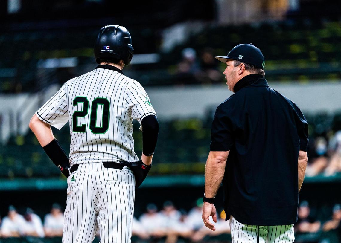 Tyler White (20) talks to his head coach Larry Vucan while on third base during a game between Carroll and Prosper at Globe Life Field in Arlington during the High School Baseball Showcase on February 28, 2021. Photo by Matt Smith. (Special to the Star-Telegram).