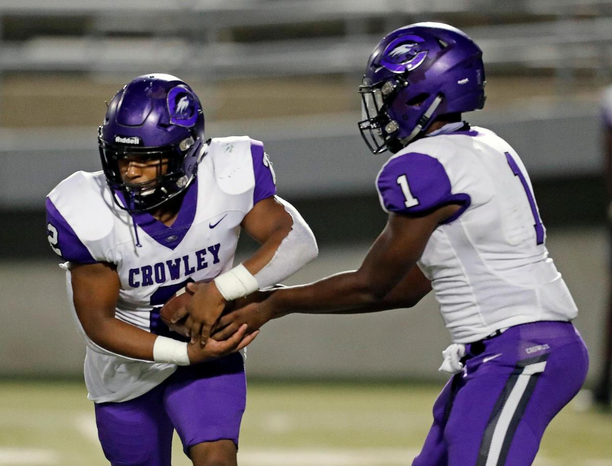 Crowley running back Daunte Blake (2) takes the handoff from running back Antwuan Polk (1) during a high school football game at Birdville FAAC in North Richland Hills, Texas, Friday, Oct. 09, 2020. The two backs played quarterback with the Eagles quarterback sidelined with a broken hand. Birdville defeated Crowley 21-14. (Special to the Star-Telegram Bob Booth)