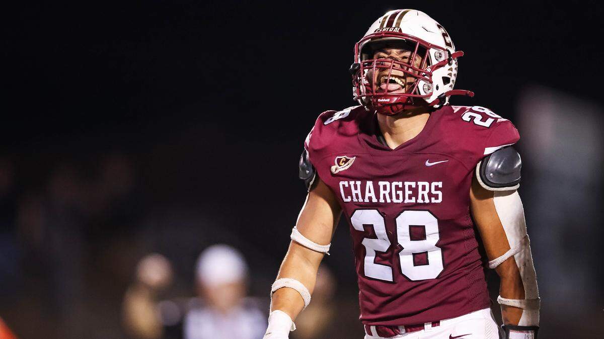 Keller Central kicker Austin Martin sticks his tongue out in celebration after throwing a pass for a touchdown on a fake field goal attempt during a district game between Keller Central and L.D. Bell at Keller ISD Stadium in Keller, Texas on October 16, 2025.