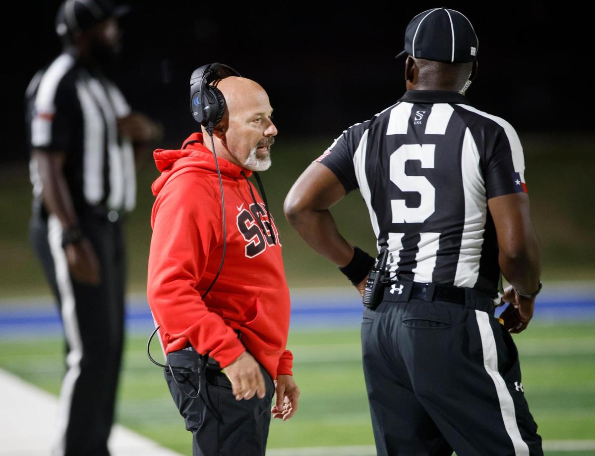 South Grand Prairie head coach Laban DeLay talks to side judge Jernard Griggs during a UIL District 8-6A football game at Birdville Fine Arts/Activity Complex in North Richland Hills, Texas, Thursday, Oct. 31, 2024.