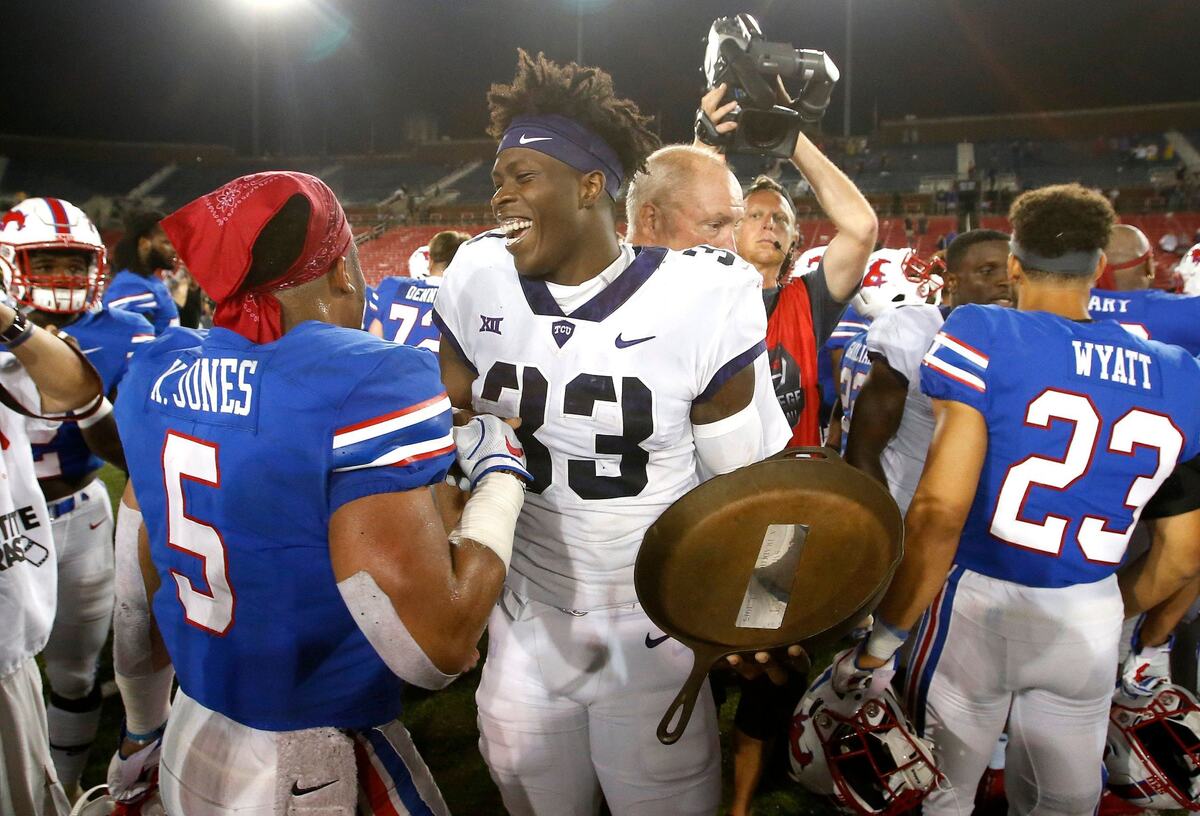 TCU Horned Frogs running back Sewo Olonilua (33) celebrates with the Iron Skillet following a 42-12 win against the Southern Methodist Mustangs on Friday, Sept. 7, 2018.