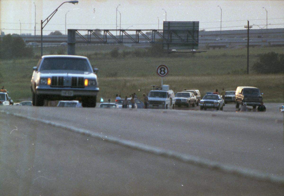 Vehicles on a tarmac.