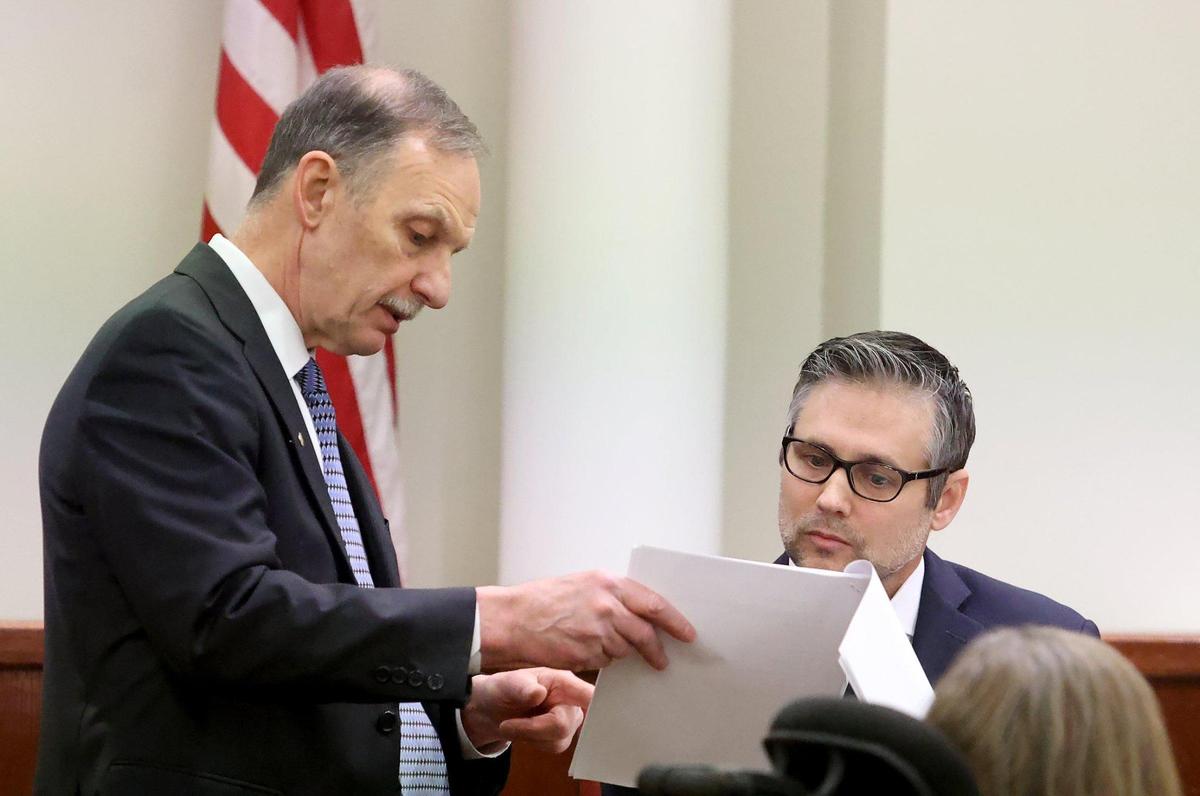 Defense attorney Bob Gill, left, questions psychologist Dr. Kyle Clayton during the sentencing phase of Aaron Dean’s trial in Tarrant County’s 396th District Court on Friday, December 16, 2022, in Fort Worth. Dean, a former Fort Worth police officer, was found guilty of manslaughter in the 2019 shooting death of Atatiana Jefferson.