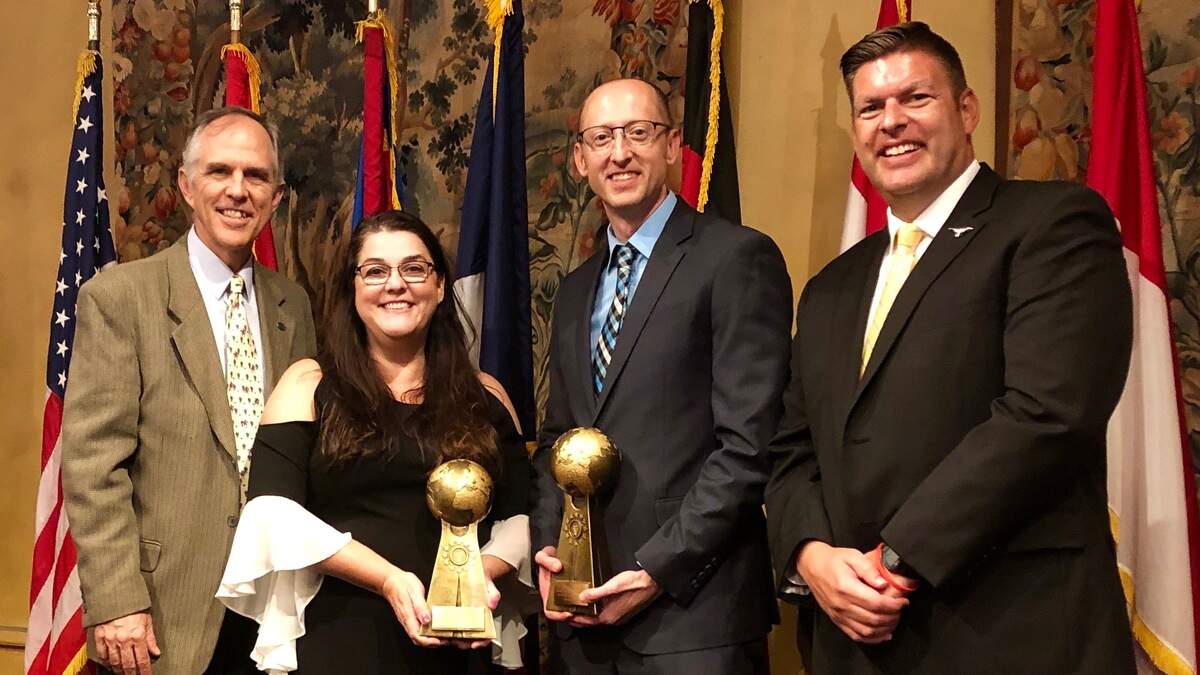 Fort Worth Country Day Head of School Eric Lombardi, left, upper school French teacher Andre’anne Annis, Director of the FWCD Center for International Studies and Assistant Head of Middle School Stephen Blan, and middle school French/Spanish teacher Rob Napier celebrate as Country Day came away with two top honors at the Fort Worth Sister Cities International 2019 meeting.