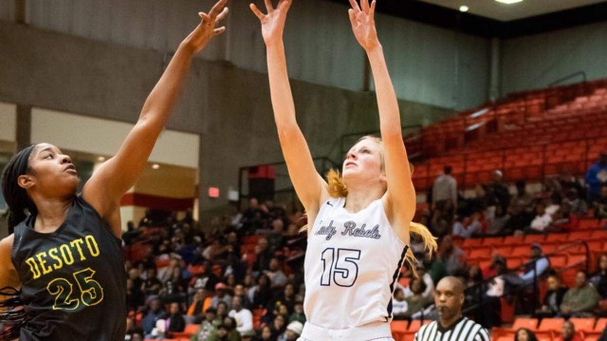 Richland’s Annika Gorman (right) shoots over DeSoto’s Ash’a Thompson in a 6A Region I semifinal game from Wilkerson-Greines Center, Friday, Feb. 22, 2019.
