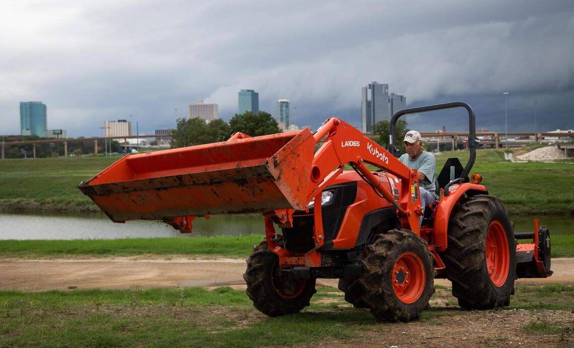 Greg Joel drives a tractor across Opal’s Farm on Sept. 1 in Fort Worth. The farm, which grows a little of everything, including watermelon, herbs, tomatoes, potatoes, beans and greens, produces food for the Community Food Bank, Funkytown Fridge, the WIC Program and more.