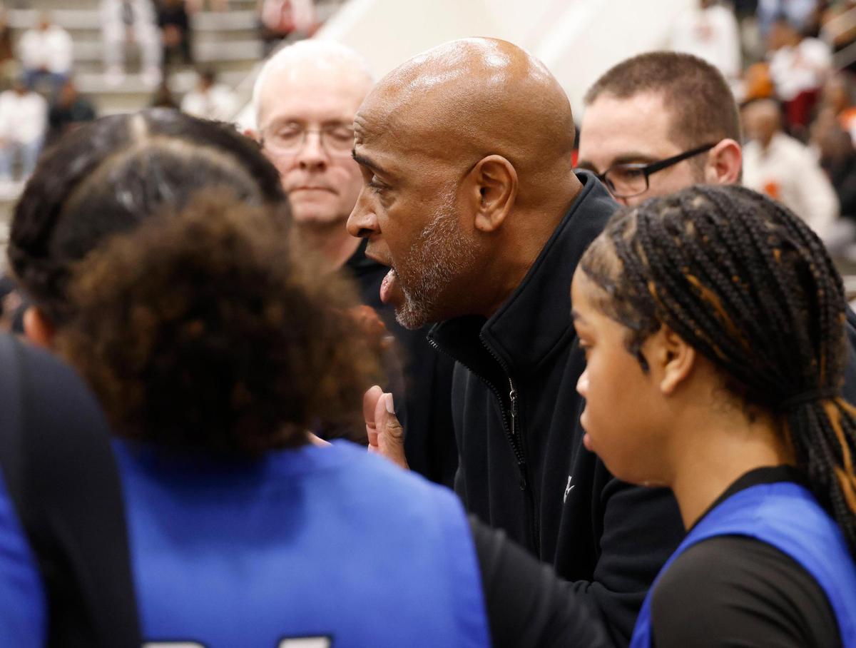Fort Worth Boswell head coach John Reese talks to the team during a time out during the second half of the UIL Class 6A D2 state semifinal girls basketball game against Lancaster at The Colony High School in The Colony, Texas, Tuesday, Feb. 25, 2025.