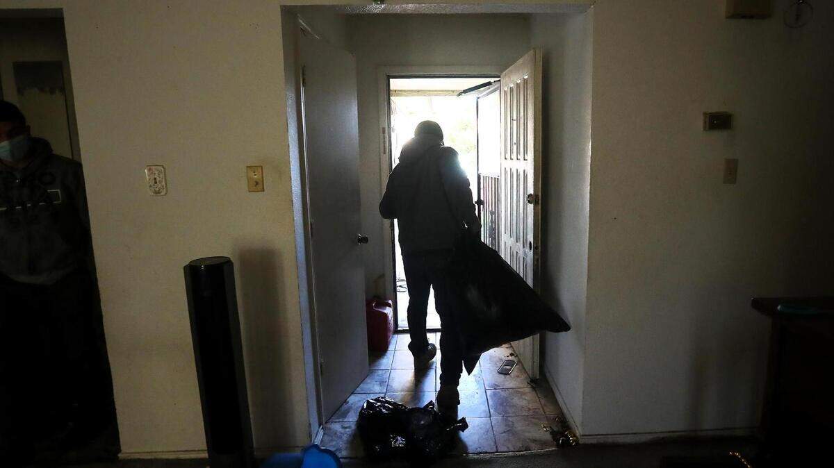 Tarrant County will soon close its emergency rental application program, following the closure of similar programs in Arlington and Fort Worth. In this February 2021 file photo, a crew removes the possessions of former tenants from a home in south Fort Worth.