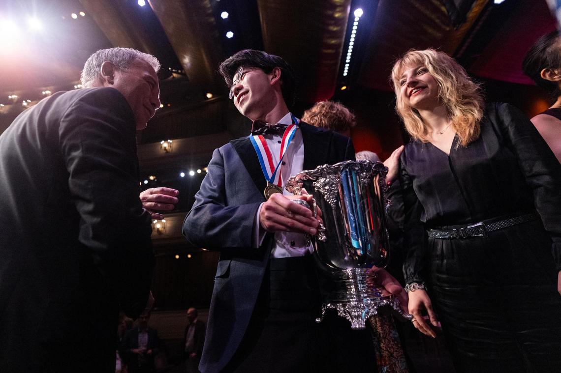 Members of the competition jury congratulate Aristo Sham of Hong Kong, China after winning the Nancy Lee and Perry Bass Gold Medal award and Van Cliburn Winners Cup during the Van Cliburn International Piano Competition Awards Ceremony at Bass Performance Hall in Fort Worth on Saturday, June 7, 2025.