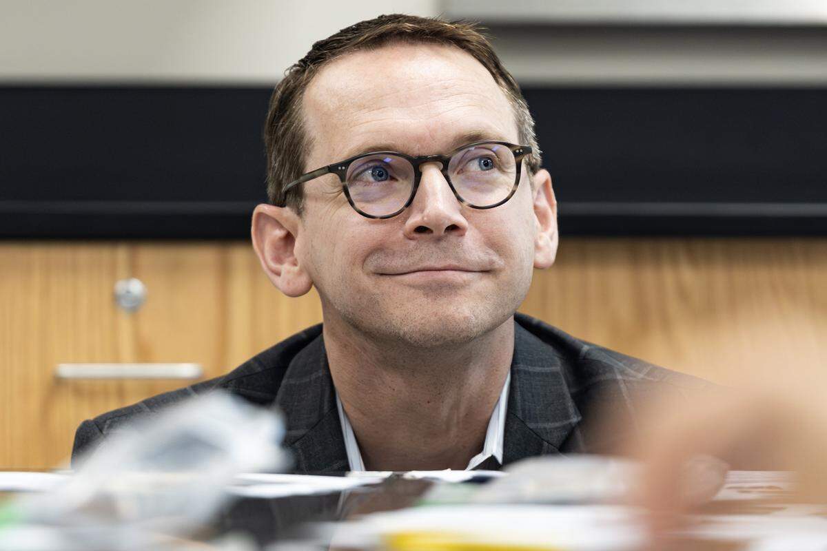 Mike Morath, the Texas Commissioner of Education, looks over the work of a student in a science class at Lucyle Collins Middle School in Lake Worth on Tuesday, Oct. 21, 2025.
