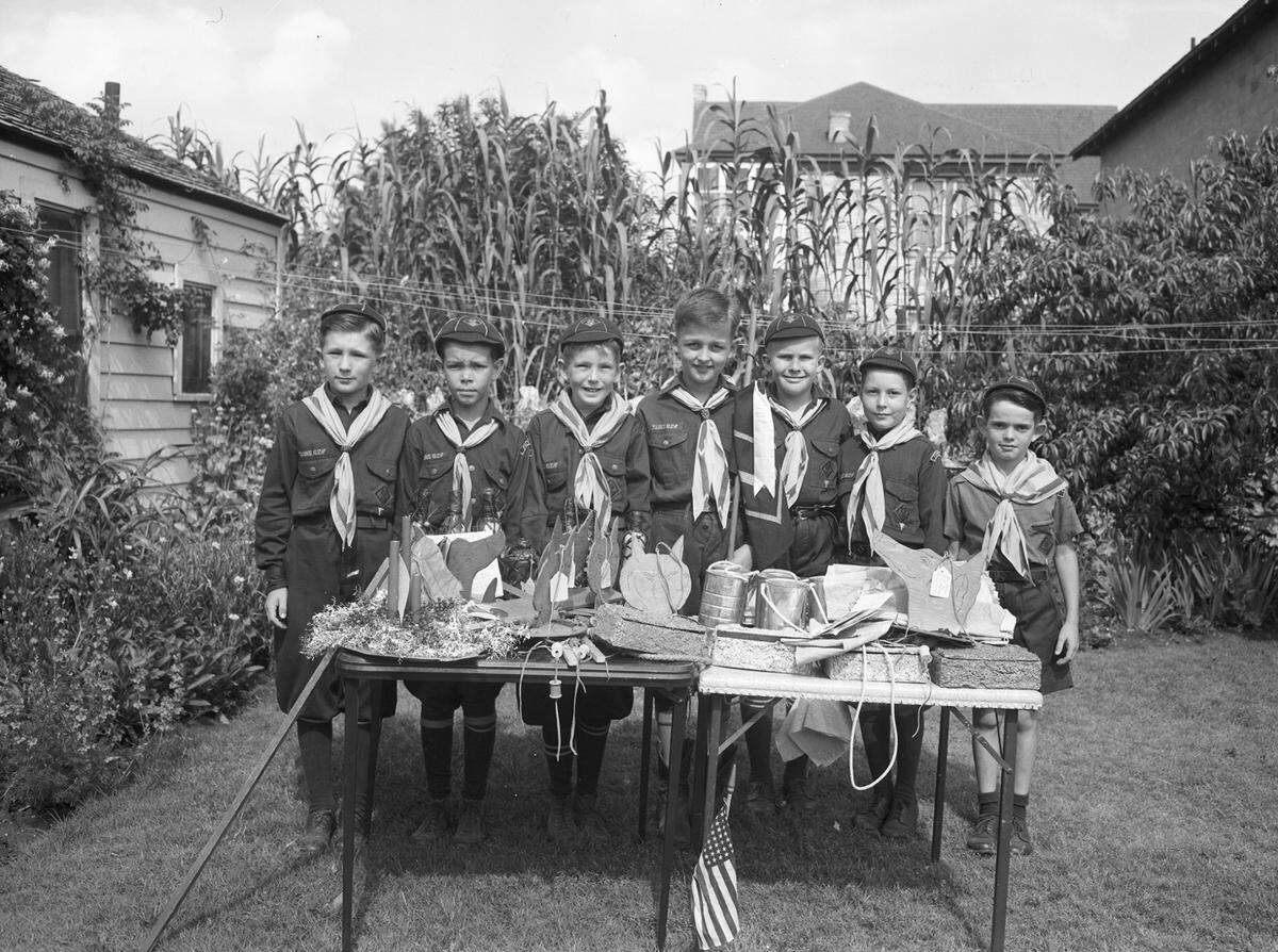 May 11, 1945: Cub Scouts, left to right: Buddy Bruner, Jimmy Ginn, Victor Tinsley, Junior, Dan Creson, Dale Stephenson, John Cassidy and Donald Dean. Cub Scouts of Pack 3, Den 2, Horned Frog District, who received a blue ribbon for their handicraft exhibition last week. Pictured on the tables are some of their prize-winnings handicraft work.
