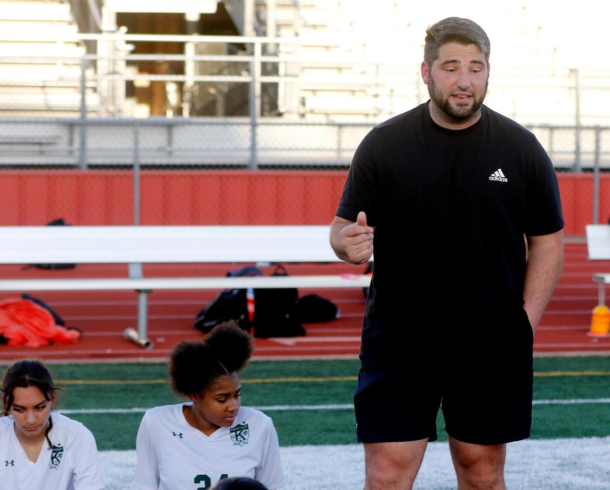 Kennedale head coach Patrick Hughes talks to the team between halves during a 4A Region 1 bi-district girls soccer playoff game at Elk Stadium in Burleson, Texas, Friday, Mar. 25, 2022. Kennedale moves on after defeating Carter Riverside 5-1. (Special to the Star-Telegram Bob Booth)