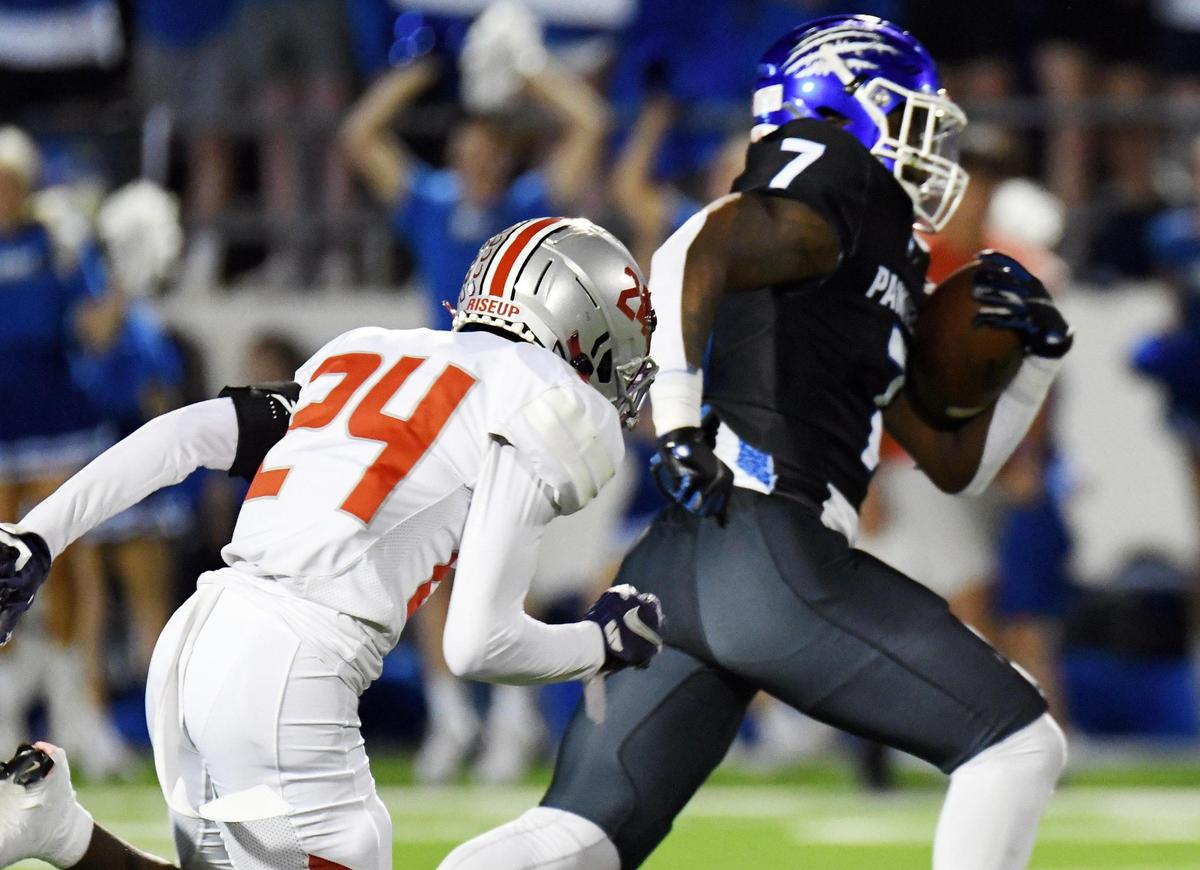 Lake Belton’s Bruce Onchweri, left chases Midlothian’s Deago Benson as he breaks way to race for a touchdown to take a 14-13 lead in the second quarter of Friday’s October 21, 2022 District 4-5A Division 1 football game at Midlothian ISD Stadium in Midlothian, Texas. Special/Bob Haynes