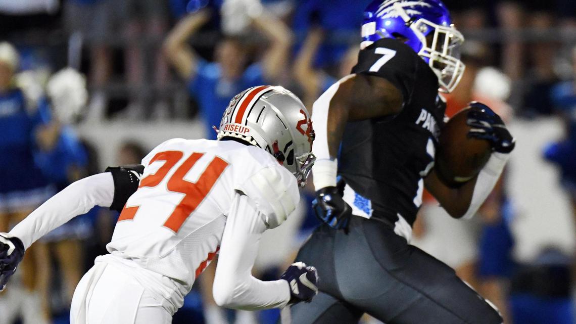 Lake Belton’s Bruce Onchweri, left chases Midlothian’s Deago Benson as he breaks way to race for a touchdown to take a 14-13 lead in the second quarter of Friday’s October 21, 2022 District 4-5A Division 1 football game at Midlothian ISD Stadium.
