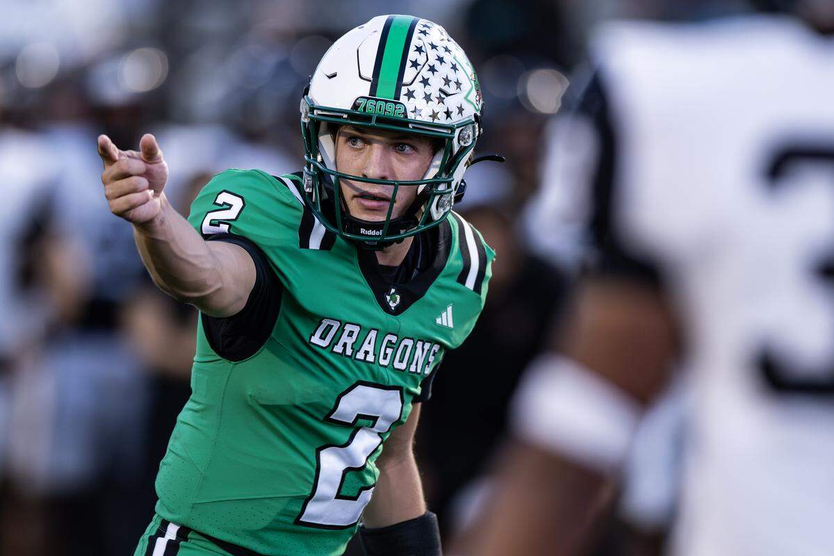 Southlake Carroll quarterback Angelo Renda (2) calls for motion at the goal line in the second half of a high school game between Southlake Carroll and Euless-Trinity at Dragon Stadium in Southlake on Friday, Sept. 19, 2025.