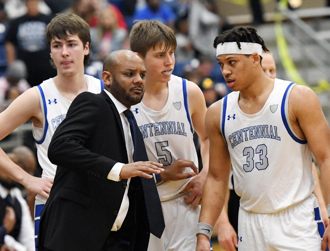 Centennial basketball coach Trovocie Jackson, front talks with players Jeb Tobin, Marek Kerr and Zach Bolf duirng the final seconds before their 75-67 5A Region 1 Quarterfinal basket ball game against Seguin, Tuesday, March 3, 2020 at Mansfield High School in Mansfield. Texas. Special/Bob Haynes