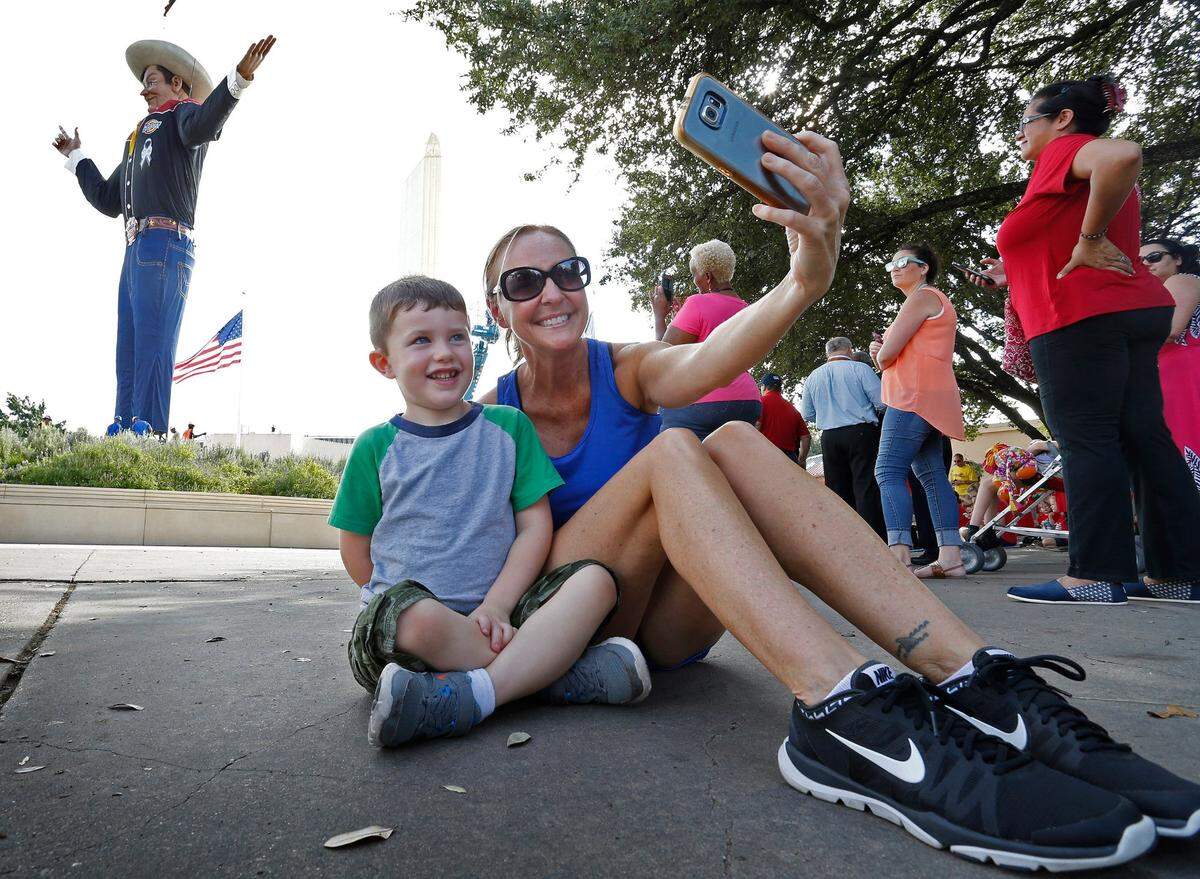 Sept. 23, 2016: Melissa Steed of Dallas makes a selfie with Lincoln Jones, 4, at the State Fair of Texas.