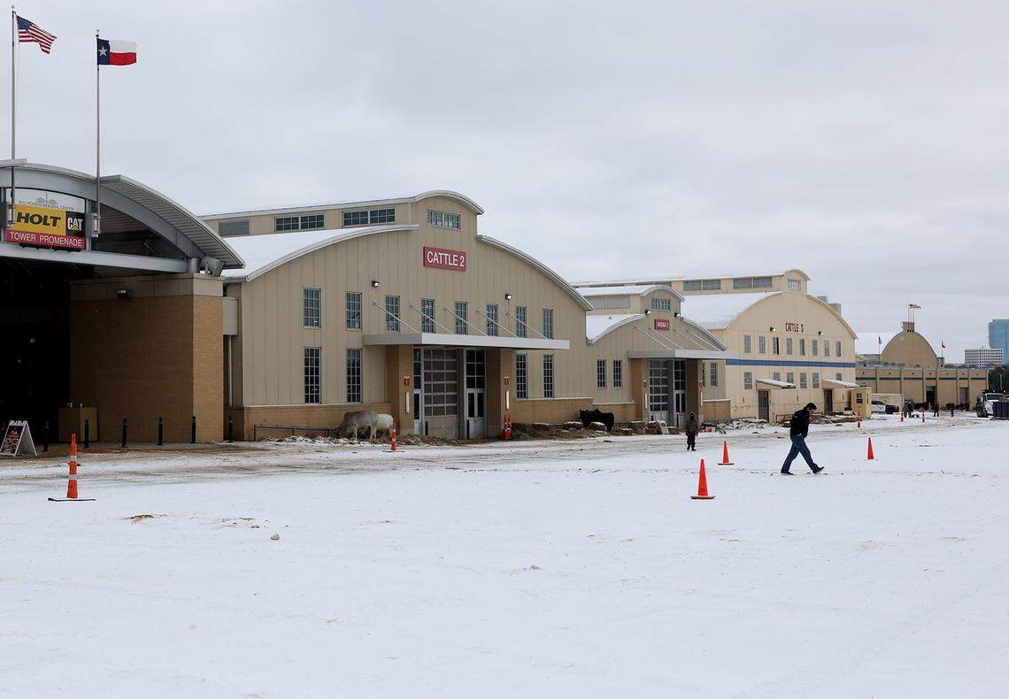 Snow covers the ground at the Fort Worth Stock Show &Rodeo barns on Sunday, Jan. 25, 2026, in Fort Worth. The stock show continued despite the winter weather. Communications director Matt Brockman encouraged folks coming to the show to bundle up and travel safe if they plan on coming this weekend