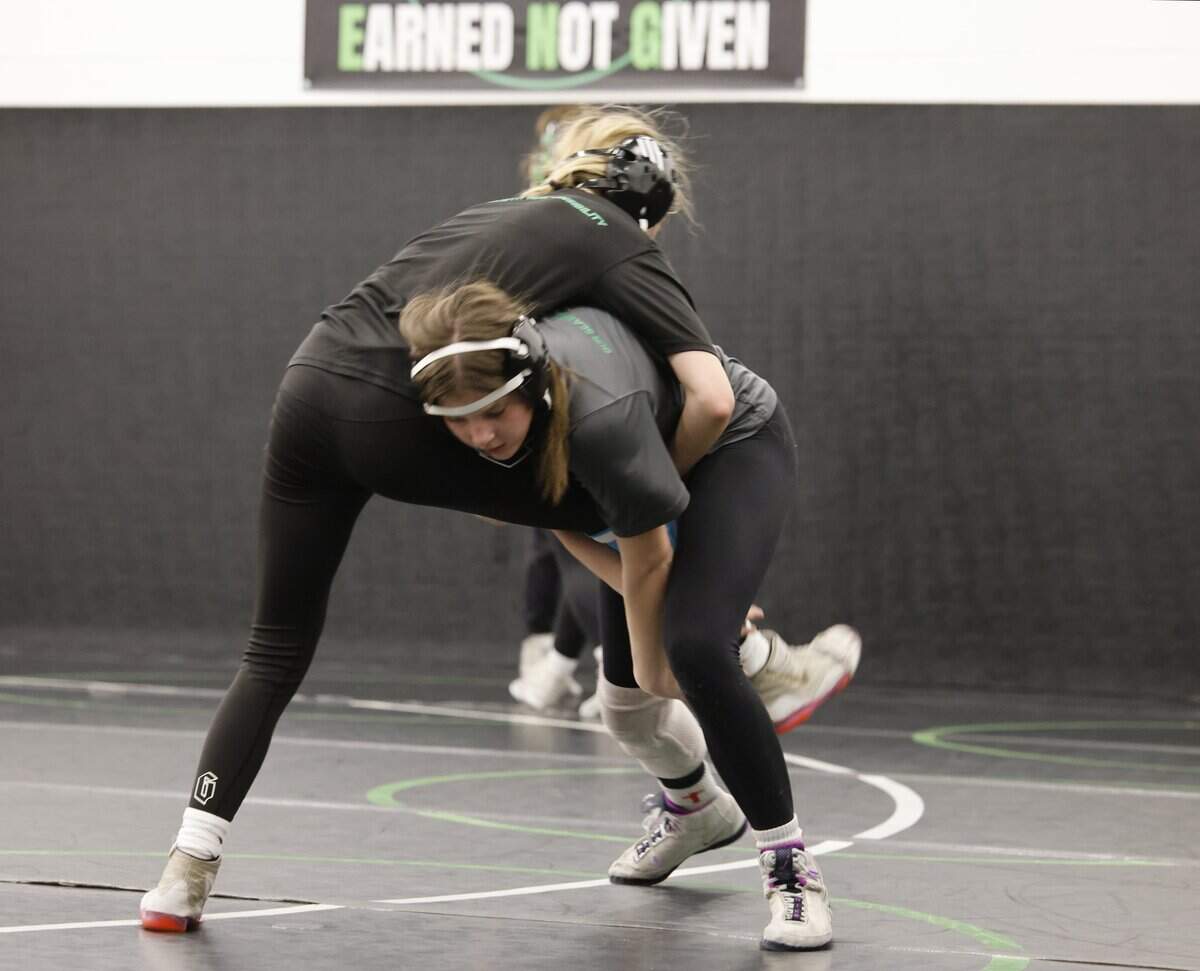 Axle wrestler Kenzie Harris puts Noah Kovach in a leg hold during one of the final practices before the state championship meet at Azle High School in Azle, Texas, on Friday, Feb. 9, 2026.