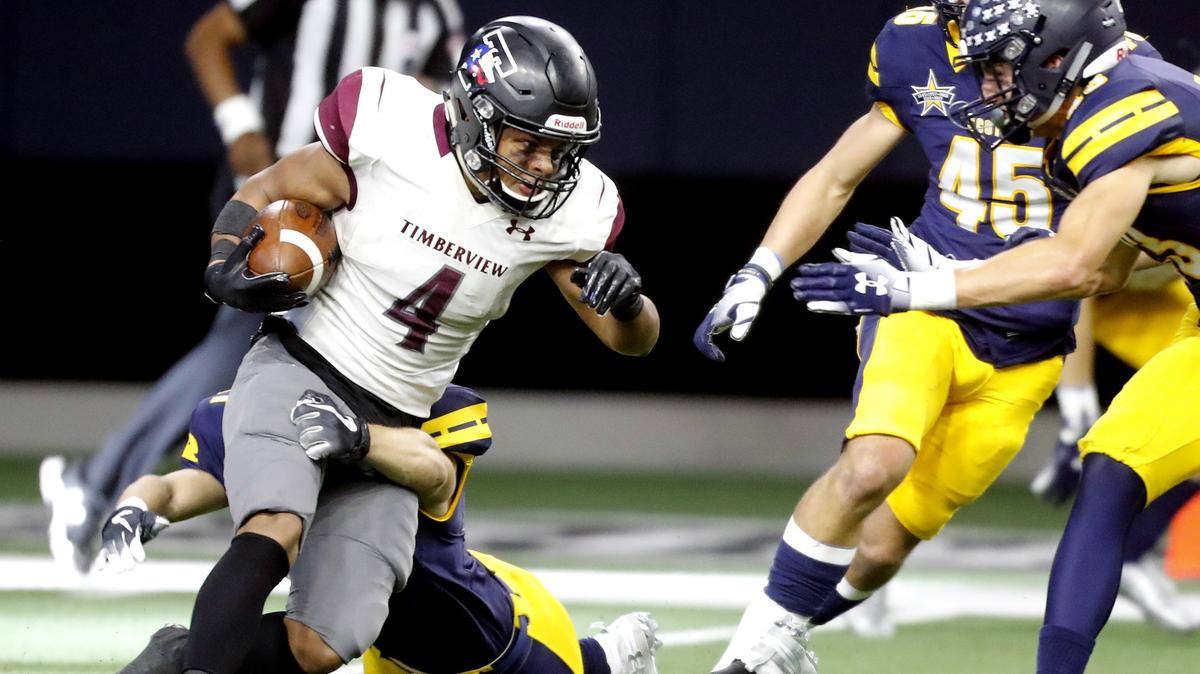 Timberview running back Montaye Dawson (4) takes off for short yardage in the second half of a high school 5A Division I Regional Round football playoff game at Ford Center in Frisco, Texas, Saturday, Dec. 01, 2018. Highland Park won 52-7. (Star-Telegram Bob Booth)

