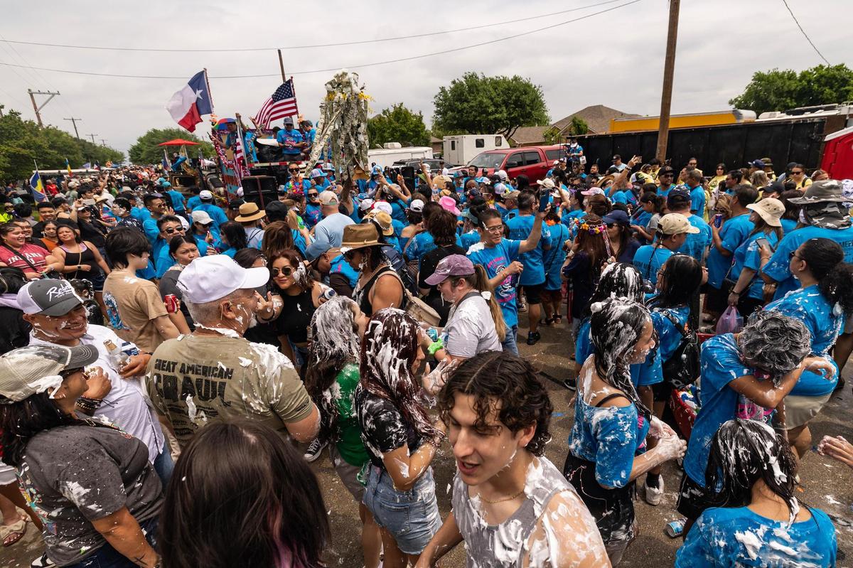 Tens of thousands of festival attendees flock the streets for the Lao New Year parade on the third day of the Lao New Year festival at Wat Lao Thepnimith Temple in Saginaw on Sunday, April 27, 2025.
