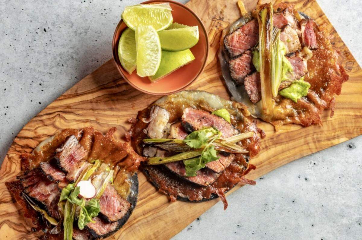 Rib-eye tacos with green salsa, avocado and charred serranos at Toro Toro for Cinco de Mayo 2023.