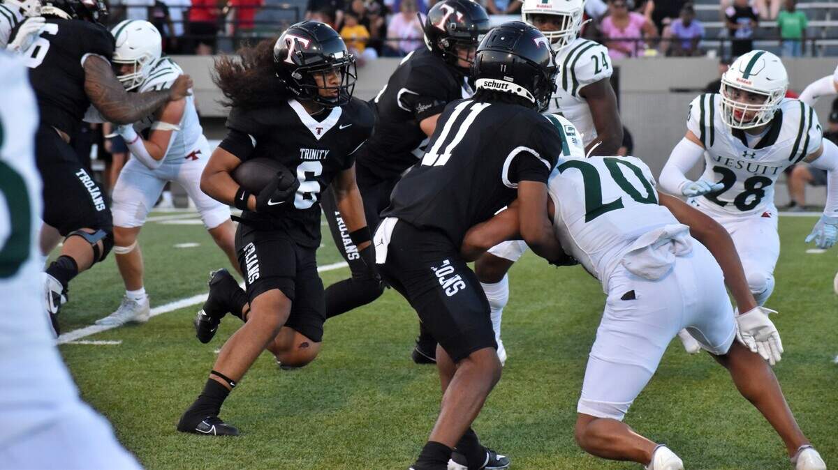 Euless Trinity fullback Michael Saafi carries the ball in the first half in a game Friday against Houston Strake Jesuit at Pennington Field in Bedford on Aug. 30, 2024.