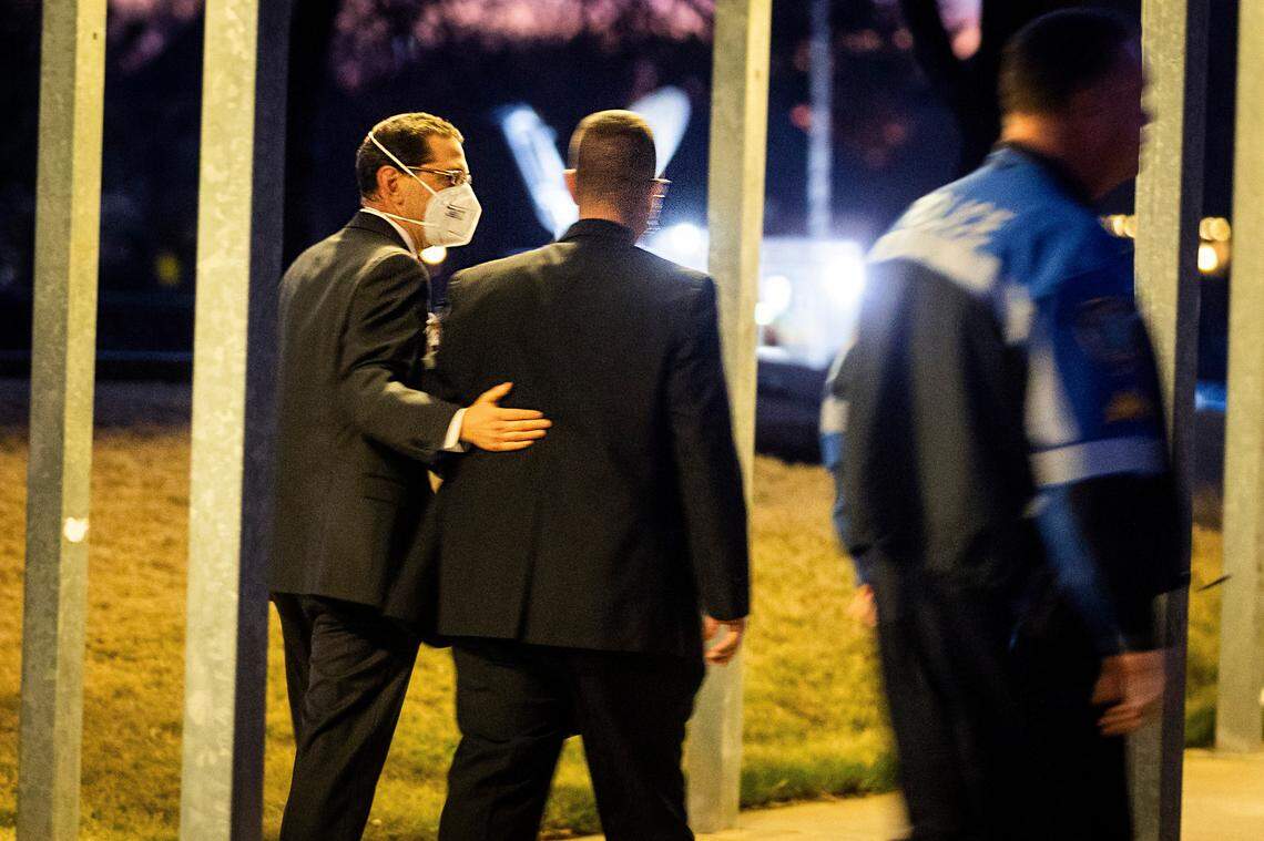 Rabbi Charlie Cytron-Walker, left, leaves a healing service two days after the hostage standoff in January.