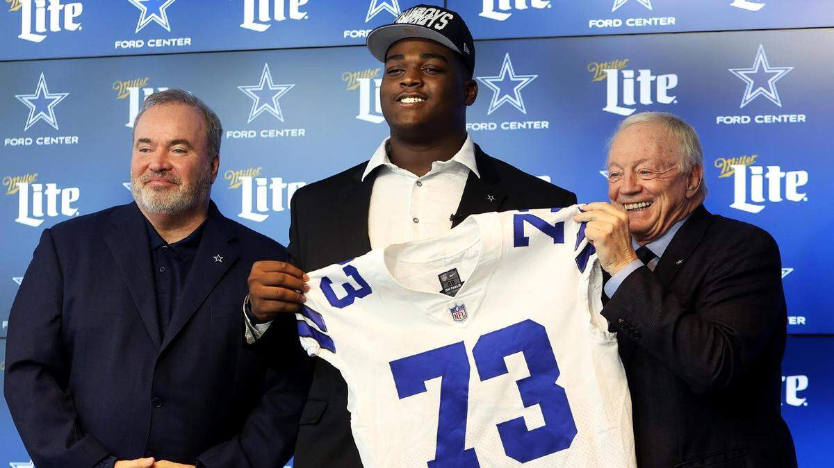 Dallas Cowboys first round draft pick Tyler Smith, center, is one of three rookie competing for starting jobs.