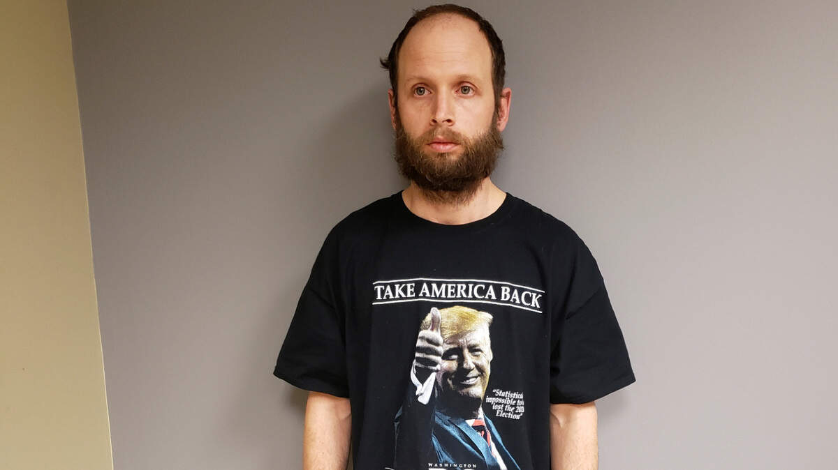 This undated photo provided by the United States Attorney’s Office, Northern District of Texas shows Garret Miller after he was arrested in Dallas. Miller didn’t speak to the law enforcement officers who arrested him on charges he stormed the U.S. Capitol in January, but the T-shirt he was wearing at his Dallas home that day sent a clear and possibly incriminating message. Miller’s shirt had a photograph of former President Donald Trump, and it said “Take America Back” and “I Was There, Washington D.C., January 6, 2021,” federal prosecutors noted in a court filing Monday, March 29, 2021.
