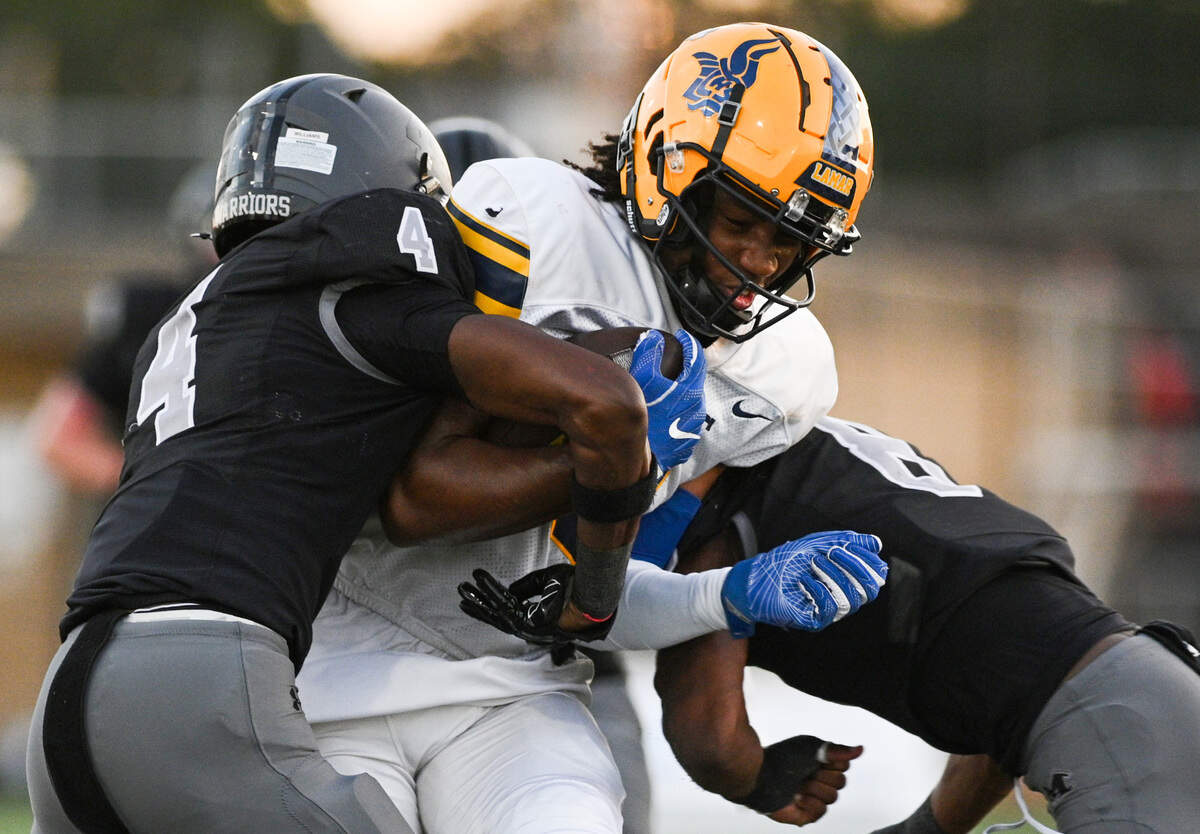 Lamar High School wide receiver Gregory Peoples Jr. (6) gets tackled by Martin High School defenders during a UIL football game against Martin High School at Cravens Field in Arlington, Texas on Friday, Sept. 20, 2024.