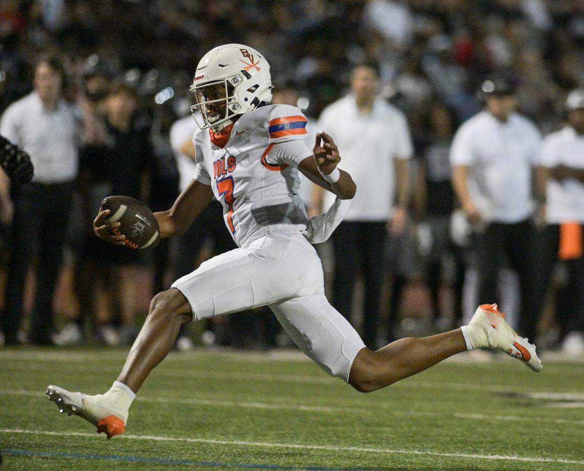 Bowie Volunteer quarterback Larry Nichols (7) runs towards the end zone during a UIL football game against Martin High School at Cravens Field in Arlington, Texas on Friday, Oct. 11, 2024