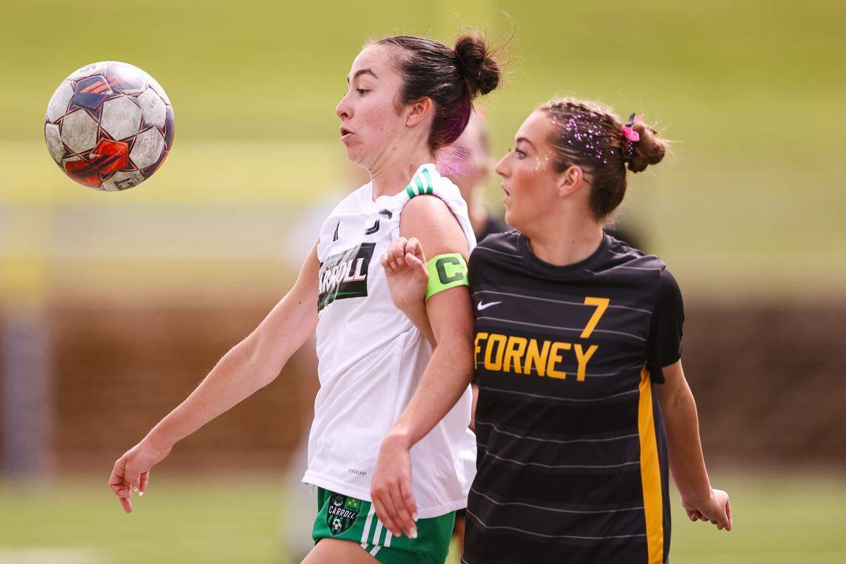 Southlake Carroll midfielder Peyton Hayes (3) battles with a Forney defender for the ball in a UIL Class 6A Division 2 girls soccer state semifinal on April 4, 2026, at Memorial Stadium in Mesquite, Texas.