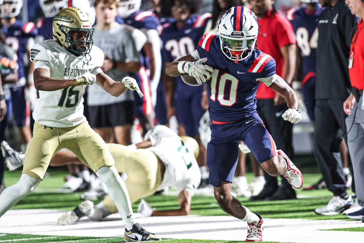 Richland receiver Ben Sanders makes a catch on the sideline in front of Birdville’s Nyles Hackley (16) in the Friday, Sept. 26 game, at Birdville ISD FineArts/Athletics Complex.