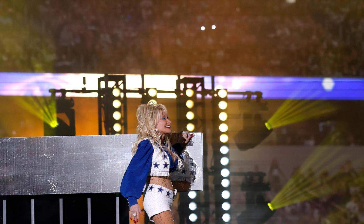 Dolly Parton performs during the Dallas Cowboys’ halftime show to kickoff the Red Kettle Campaign on Thursday, November 23, 2023, at AT&T Stadium in Arlington.