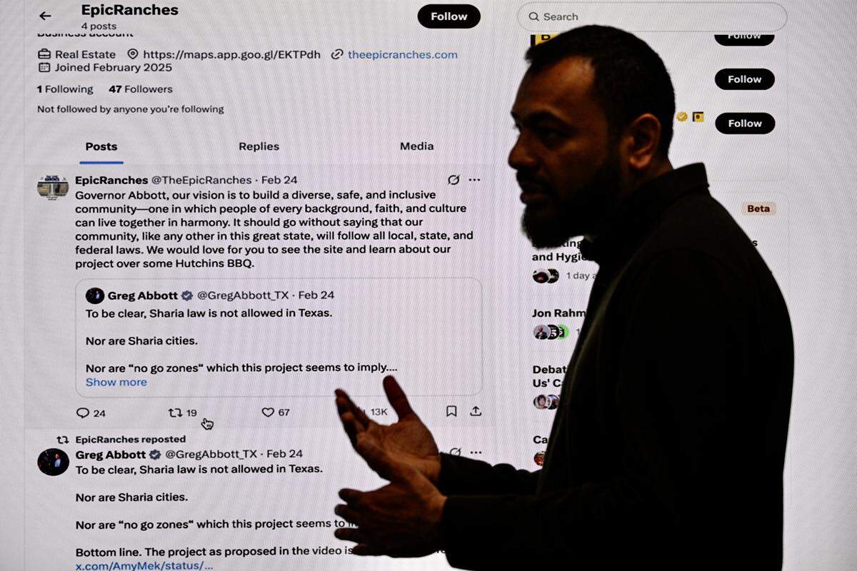 Imran Chaudhary, President of Community Capital Partners, a company leading the real estate project of East Plano Islamic Center, speaks as he shows a post in X.com by Gov.Greg Abbott in Plano, Texas, on April 11, 2025 over plans to build 1,000 new homes, a community center, school, hospital, mosque and Islamic private school to serve the growing Muslim community near East Plano.