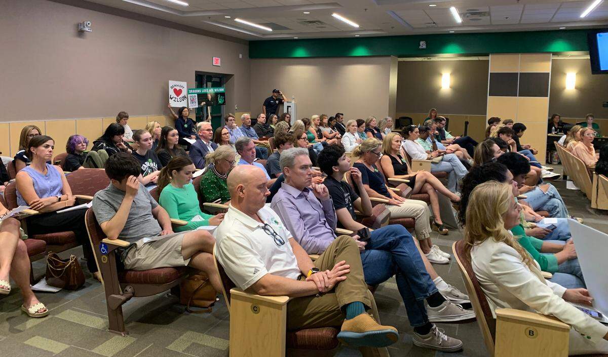 Southlake Carroll students, parents and teachers filed into the school board room to speak out against the reassignment of head swim coach Kevin Murphy and the non-renewal of senior high school principal Ryan Wilson on May 19, 2025.
